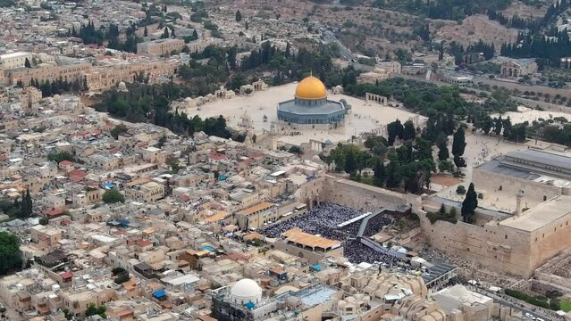 Drone over western wall during Jewish priestly blessing
Jewish worshippers gather for the Birkat Kohanim (priestly blessing) at the Western Wall in Jerusalem, aerial view,2024
