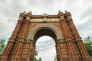 Barcelona, Spain - may 4 2024 Tourists walking and looking at Arco de Triunfo