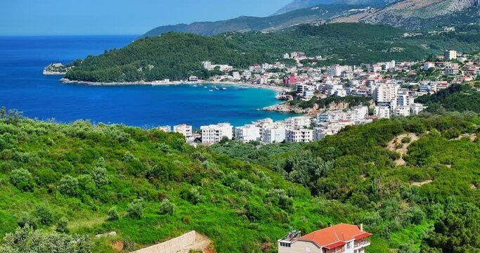 Aerial view of Himara, a small town in the coast of Albanian Riviera showing the mountain terrain and beautiful Ionian sea. 
