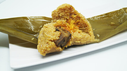 Traditional wrapped rice dumpling or zongzi on a plate