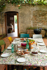 Set table under a garden canopy in summer