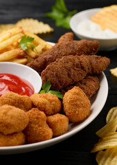 Chicken nuggets, Southern strips, Chicken fingers, french fries, chips, various sauces and beer
