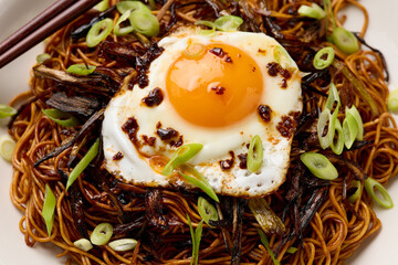 Scallion Oil Noodles with fried egg on top and chilli oil