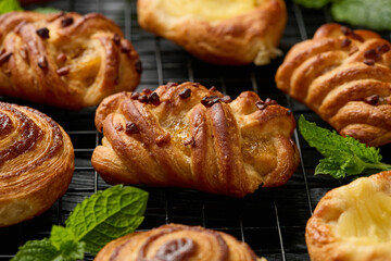 Mini danish pastry selection. Maple pecan plaits, cinnamon swirls and vanilla creme crowns