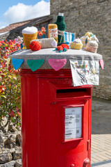 red post box with topper