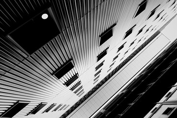 Urban background with exterior buildings facade in Munich,  Germany. Black and white image.