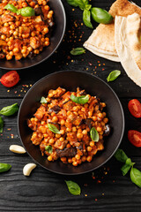 Eggplant and Chickpea Stew in tomato sauce, garlic, spices and pita bread. Healthy food