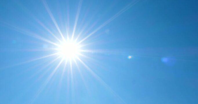 4K - Sun is at its zenith on a clear blue sky