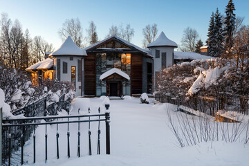 Country house (cottage) on a frosty winter day