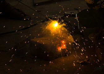 Welding Closeup. Bright Sparks and Smoke Looks Very Beautiful. 