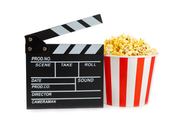 Tasty popcorn in buckets and cold cola drinks with cinema tickets, movie clapper and 3D eyeglasses...