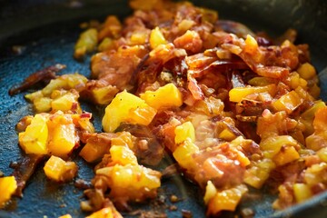 Step-by-step cooking process. Fry the sliced sausage in a frying pan with tomatoes and onions