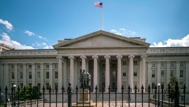 Day time lapse of the Treasury Building from the sidewalk with clouds moving above