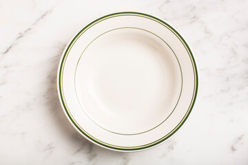 Overhead of empty clean plate on marble surface