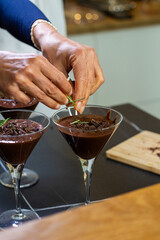 Close up of a Woman Chef Crafting Chocolate Mousse