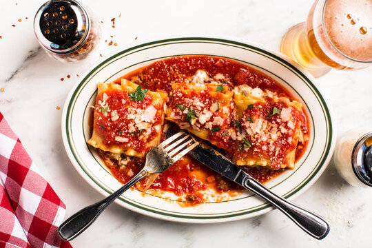 Overhead of plate of pasta on marble surface