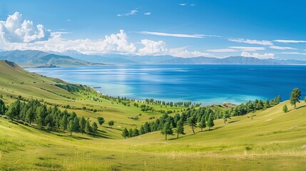 Obraz premium Wide View of Lake Baikal in Summer Surrounded by Greenery and Mountains, Wallpaper: Scenic Landscape of Lake Baikal with Clear Blue Water and Verdant Shores