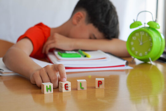 child with learning difficulties in school, frustrated doing homework, asking for help and attention to his problem