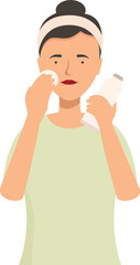 Young woman applying cream on her face with a cotton pad for her daily skincare routine