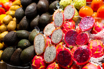 Fresh raw dragon fruit on open market. Healthy and food concept. Tropical fruits display at a farmers market