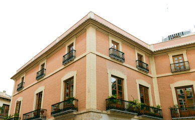 A street in the historical old town of Valencia. typical Spanish real estate blocks during a summer day