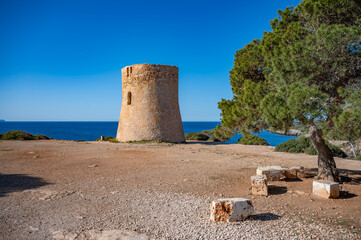 Torre de Cala Pi, Majorca, view from the distance with sea in the background, clear sky, Mallorca