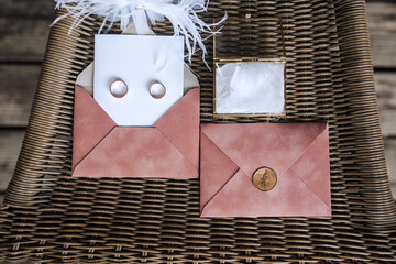 Wedding photograph close-up of accessories, details of the bride: envelope, invitation, box with...