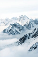 Obraz premium Jagged Peaks Piercing Through Clouds: A Serene Alpine Landscape of Snow-Capped Mountains Under a Clear Sky