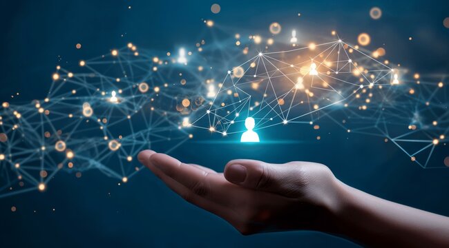 A hand holds a holographic network of interconnected people icons, symbolizing digital connectivity and social networking on a dark blue background with light effects.