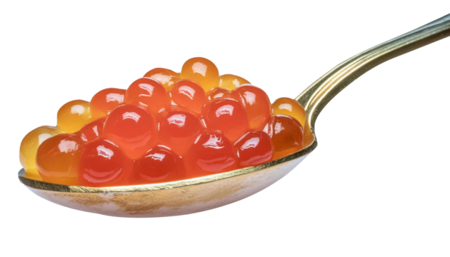 Detailed shot of a spoon holding luscious red caviar, against a clear background