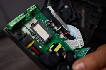 Fototapeta premium burnt Electronic circuit board with cooling fan and ribbon cable for hardware technology