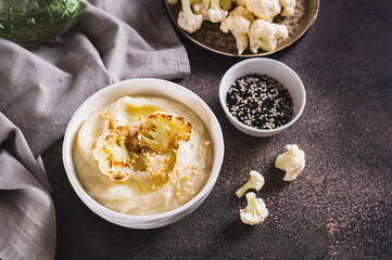 Vegetarian dietary cauliflower puree in a bowl on the table