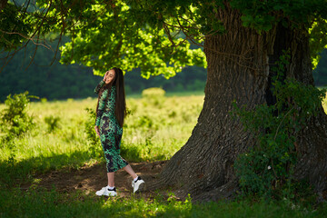 Beautiful Hispanic woman in oak forest