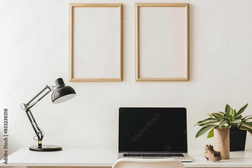 Poster minimalist image of two 3x2 wooden picture frames of the same size and dimensions hanging side by side on a white wall above a minimalist desk