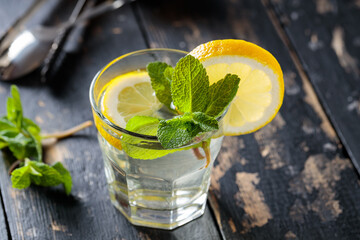 Seasonal Lemonade with Fresh Garnish on Dark Vintage Background