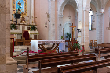 November 05, 2023. Europe, Greece, Crete, Chania. Cathedral of the Assumption of the Virgin Mary. Roman Catholic Church. Interior. Nave with pews looking toward altar. Editorial use only.