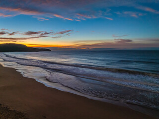Winter seascape views over the beach with high and medium cloud cover