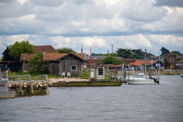 Travelling in France, old wooden huts and oysters farms in Gujan-Mestras village, cultivation and sale of fresh oysters seashells, Arcachon bay, Atlantic ocean, France, tourists destination