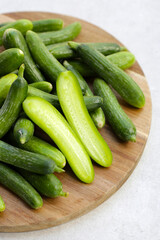 Mini cucumbers on white background.