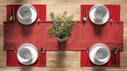 A beautifully set table with white dishes, gold silverware, and a red table runner