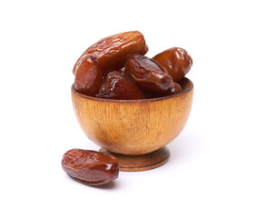 Dried dates fruits in wooden bowl