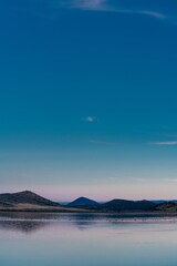 Calm tranquil lake at sunset with migratory birds. Indian Tom Lake, California, United States of America.