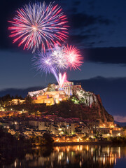 Sisteron with Bastille Day celebration (14th of July) fireworks over the Citadel at twilight....