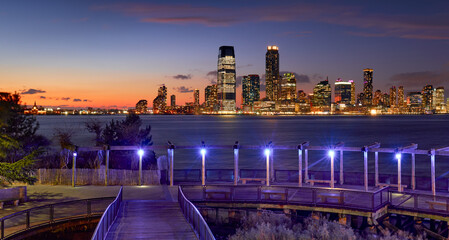 Riverfront of Jersey City viewed from Lower Manhattan in early evening. Jersey City Exchange Place...
