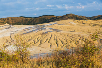 Romania, Buzău County, Berca. Geological ,botanical reservation Vulcanii Noroioși de la Paclele Mici. Small volcano-shaped structures caused by eruption of  natural gases.