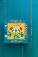Europe, Romania, Transylvania. Colorful, handpainted mail box.