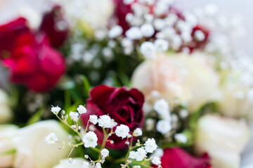 Beautiful bouquet with flowers.Festive background with red roses.