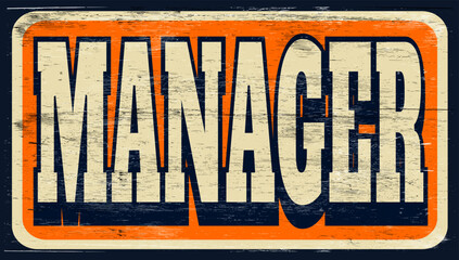 Aged vintage manager sign on wood