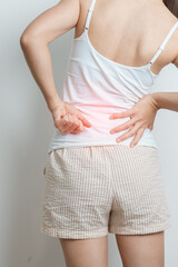 woman having back body ache during at home. adult female with muscle pain due to Piriformis Syndrome, Low Back Pain and Spinal Compression. Office syndrome and medical concept