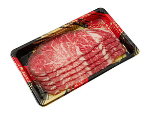 Thinly sliced ​​fresh Beef with a high layer of fat arranged on a  tray isolated on white...